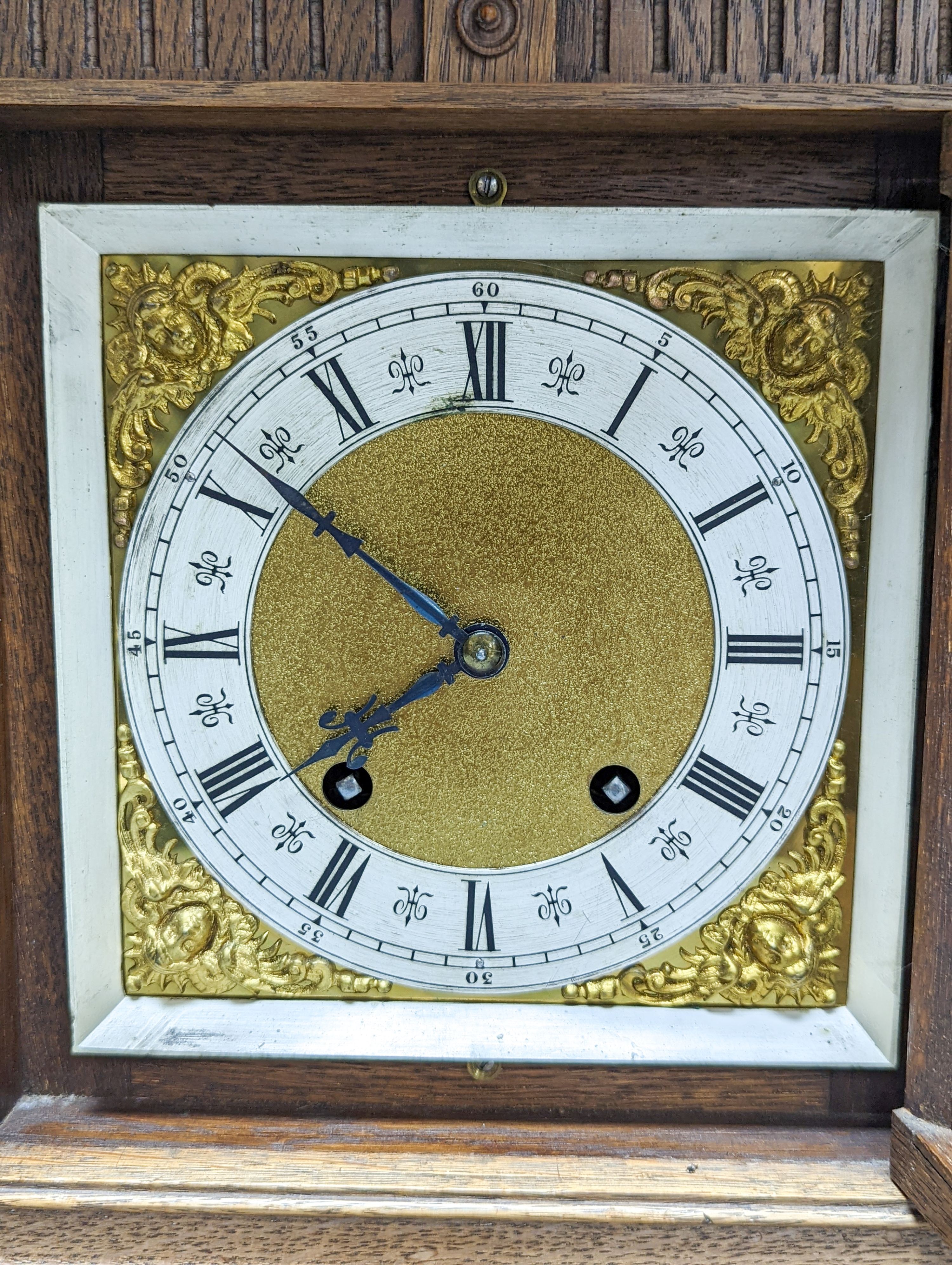 A late 19th century German oak cased eight day mantel clock